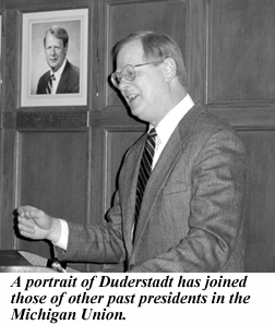 photo, Duderstadt's portrait joines those of other past presidents in Michigan Union.