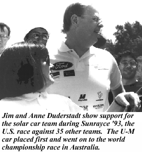 Jim and Anne Duderstadt show support for the solar car team during Sunrayce 1993, the U.S. race against 35 other teams. The U-M car placed first and went on to the world championship race in Australia.